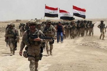 Des soldats irakiens dans le village Khorta libéré