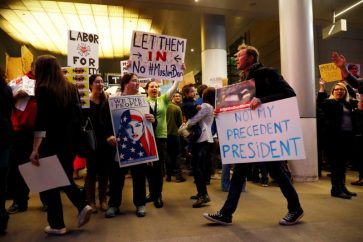 People protest Donald Trump's travel ban from Muslim majority countries at the International terminal at Los Angeles International Airport (LAX) in Los Angeles, California