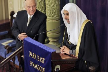 Mohammad Abdulkarim Al-Issa, Secretary-General of the Muslim World League, right, speaks as Rabbi Arthur Schneier, President of the Appeal of Conscience Foundation, listens at Park East Synagogue in New York, Monday, April 29, 2019. Al-Issa and Schneier signed an agreement to coordinate their efforts to protect religious sites and worshippers, of any religion, from violent attacks. (AP Photo/Seth Wenig)