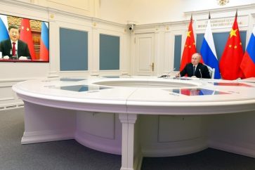Rencontre par visioconférence entre les présidents chinois et russe Xi Jinping et Vladimir Poutine, le 30 décembre 2022.