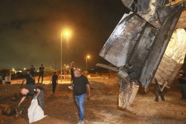 Israeli authorities inspect the remains of what the military said is a Syrian anti-aircraft rocket that exploded in the air, in the town of Rahat, Israel, Sunday, July 2, 2023. Israel carried out airstrikes on areas near the central Syrian city of Homs, the Syrian military said in a statement. A Syrian anti-aircraft rocket exploded over Israeli territory, the Israeli military said. (AP Photo)