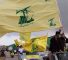 Des sympathisants du Hezbollah agitent le drapeau du parti sur une autoroute à Marjayoun, au sud-Liban. ©Reuters